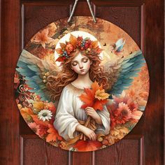 a painting of an angel with autumn leaves on it's head holding a bouquet of flowers