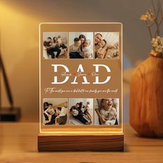 a light up photo frame with the words dad on it