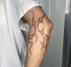 a man with a tattoo on his arm