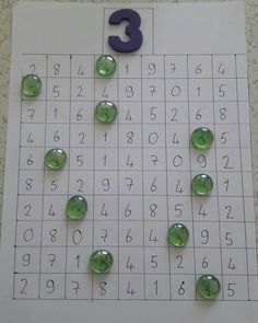 the number three is placed on top of a sud game with green buttons and numbers