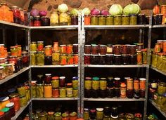 shelves filled with lots of different kinds of food and condiments in jars on metal racks