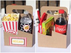 two boxes filled with different types of food and drink on top of a table next to each other