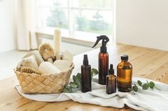 a basket filled with lots of different types of soaps and lotions on top of a wooden table