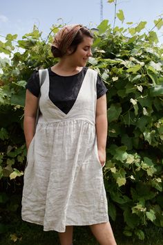 Made from 100% midweight linen.  Knee length, sleeveless dress, with a crisscrossed detail on one side of the bodice, and a scoop neck on the other, perfec to wear reversible depending on your style preference for the day.  Standard invisible pockets on either side,  Everything is customizable of course! Just choose the custom size option in the drop down menu, and leave your measurements or desired fit preferences in the personalization section when you place your order. Unlined A-line Linen Dress, Summer Linen Pinafore Dress, Linen Knee-length Sundress For Daywear, Sleeveless Linen Pinafore Dress With Pockets, Sleeveless Linen Pinafore Dress, Knee-length Summer Pinafore Dress, Summer Knee-length Pinafore Dress, Linen Dress Patterns, Dress Paterns