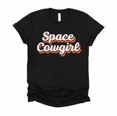 Shout yeehaw and ready your pink Gogo cowboy hat and pink party boots and enjoy a western space 70s cosmic disco cowgirl themed girls party. Be the space cowgirl chick with an awesome costume for a space cowgirl bachelorette party outfit design. This t-shirt is everything you've dreamed of and more. It feels soft and lightweight, with the right amount of stretch. It's comfortable and flattering for both men and women. * 100% combed and ring-spun cotton (Heather colors contain polyester) * Heathe Cowgirl Sorority Theme Shirts, Space Cowgirl Bandana, Disco Cowgirl Shirts, Cowgirl Bachelorette Party Outfits, Cowboys And Aliens Tshirt, Retro Cowgirl Shirts, Cowgirl Bachelorette Parties, Space Cowgirl, Cowgirl Bachelorette