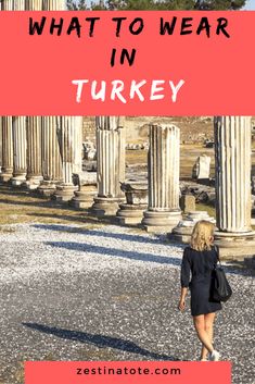 a woman walking in front of columns with text overlay that reads what to wear in turkey