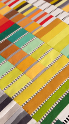 an assortment of different colored strips on a table