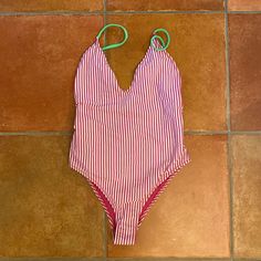 Brand New Never Worn, Tags Still Attached. Super Cute Striped, Low Back, High Cut Swimsuit. Stripes Are Pink And White With Green Straps. Size: Small Pink V-neck One Piece Beachwear, Casual Pink V-neck Swimwear, Pink V-neck Bodysuit With Lined Body, Pink Summer One-piece Swimsuit For Pool, Pink One-piece Swimsuit For Beach Season, Pink Summer One-piece For Pool, Pink Stretch Vacation Swimsuit, Pink Stretch One Piece For Vacation, Pink Stretch One-piece Swimsuit For Vacation