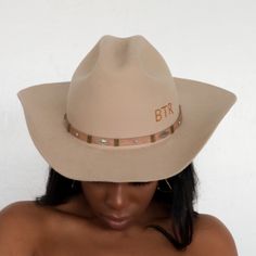 The Upland Western Cowboy Hat seamlessly blends the rustic charm of the Wild West with a dash of futuristic boho flair. With its distinctive cowboy silhouette, complete with a cattleman creased crown and a stylish upturned brim, this hat exudes classic Texan allure. The leather band is adorned with gleaming silver jewels, adding a contemporary twist to this timeless fashion statement. Handcrafted and meticulously embroidered with the initials "BTR," this hat exemplifies the perfect fusion of tra Southwestern Wide Brim Felt Hat For Western-themed Events, Fitted Brimmed Hat For Rodeo, Rustic Hats For Rodeo, Country Style Hat With Flat Crown For Country Events, Rustic Rodeo Hat, Rustic Flat Brim Hat For Rodeo, Fitted Brimmed Rustic Fedora, Fitted Wide Brim Hats For Rodeo, Fitted Wide Brim Western Hats