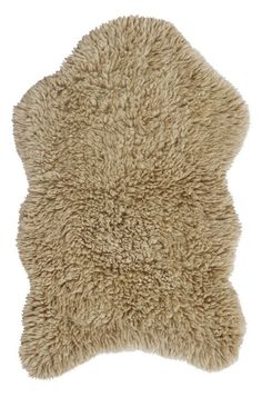 a sheepskin rug is shown on a white background