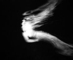 blurry photograph of person running in the dark