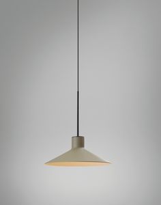 a light fixture hanging from a ceiling in a room with gray walls and flooring