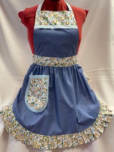 a blue apron dress with flowers on it