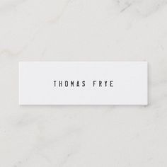 a white business card with the words thomas frye on it