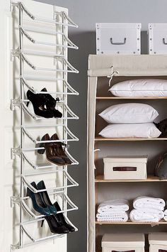 an organized closet with shoes and other items