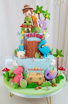 a birthday cake decorated with toys and decorations