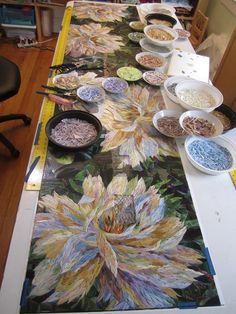 the table is covered with many plates and bowls