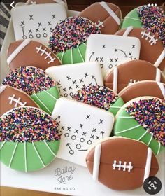 decorated cookies in the shape of footballs