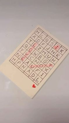 a piece of paper that has some type of writing on it with red hearts in the middle