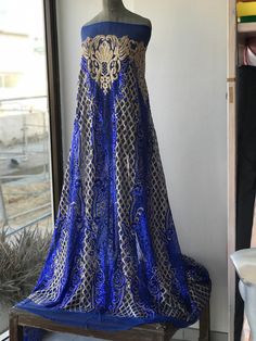 Gold and cobalt blue sequins lace fabric Rich fabric for evening formal gown Width is 135 cm Price is for one yard all order over quantity 1 will be in a continuous length Glamorous Blue Gown For Banquet, Blue Sequined Evening Dress For Wedding, Evening Blue Dresses With Zari Work, Elegant Blue Gown With Intricate Embroidery, Blue Zari Work Evening Dress, Blue Sequined Gown For Banquets, Blue Sequined Gown For Banquet, Royal Blue Sequin Gown For Wedding, Royal Blue Royal Style Gown For Party