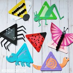 colorful paper cut outs with bugs and insects on them