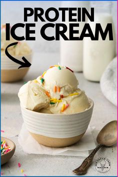 a bowl filled with ice cream next to a spoon