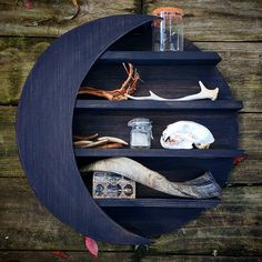 a shelf that has various items on it and is made out of wood planks