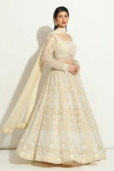 Ivory lehenga with all over pearl embroidered floral jaal and scallop patterns. Comes with padded pearl tasselled blouse and embroidered dupatta. Components: 3 Pattern: Embroidered Type Of Work: Pearl Neckline: Square Sleeve Type: Full Fabric: Organza  Color: Ivory Other Details:  Attached lining Lehenga length: 42 inches Weight: Approx 4-5 kgs Closure:  Lehenga: Side drawstring Blouse: Back hook Occasion: Wedding,Bride,Destination Wedding - Aza Fashions Indian Bridesmaid Dresses, Lehenga Pattern, Anushree Reddy, Full Sleeve Blouse, Organza Lehenga, Lehenga Designs Simple, Bridal Elegance, Bridal Lehengas