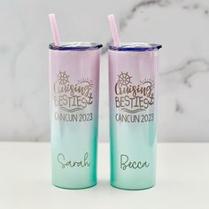 two personalized tumblers with straws sitting on top of a white countertop