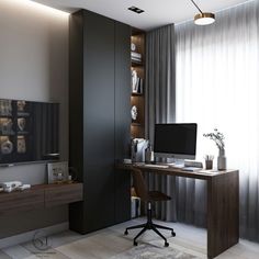 a desk with a computer on top of it in front of a large screen tv