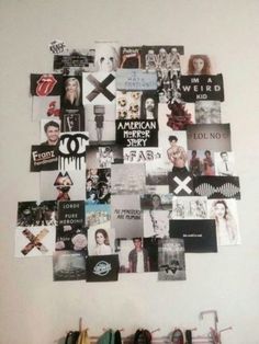 a white wall covered in pictures and magnets