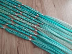 "Want a pop of luscious color, easy and fast? Pre-braided extensions are a fun and reusable way to get a chic braided look, easily attached with a latch hook! They can also be used in a variety of hair accessory or costume projects. Aqua and blonde blend with wispy ends and silver beads This listing is for a single braid, multiple may be purchased to achieve the pictured look! These are long braids, averaging 18\"-20\", in fluffy boho fishtail style about .5\" across it's wide points. These are Braided Extensions, Braid Hair Extensions, Hair Braid Patterns, Hot Hairstyles, Synthetic Braids, Single Braid, Synthetic Dreadlocks, Braid Patterns, Braid In Hair Extensions