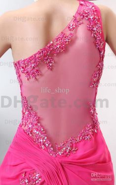 the back of a pink dress with sequins and beading on it's neck