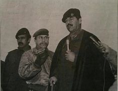 an old black and white photo of two men with microphones in their hands, standing next to each other