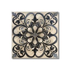 an intricately designed tile with black and white designs on the back side, in shades of