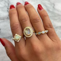 A stunner to stack. DETAILS Metal - 14k yellow gold Stone(s) - 0.80tcw oval opals Band width - 2mm WHY WE LOVE IT This five-stone ring features a 0.80tcw of east to west oval opals bezel set in 14k yellow gold. This ring can do it all - wear this as your go-to ring for stacks and layering. Gift it to your most beloved October baby. Or, if opals have special meaning, seal your vows with this as your wedding band. More from our Opal + Moonstone Collection. SHIPPING + RETURNS Currently sized at a 7 Gold Opal Stackable Ring With Oval Shape, Heirloom Style Oval Diamond Stackable Ring, Heirloom Oval Diamond Ring Stackable, Heirloom Style Oval Stackable Diamond Ring, Oval Multi-stone 14k Gold Diamond Ring, Oval 14k Gold Multi-stone Diamond Ring, Yellow Gold Oval Stackable Rings With Halo, Yellow Gold Stackable Oval Rings With Halo Detail, Yellow Gold Oval Stackable Rings With Halo Detail