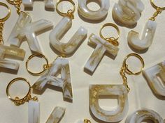 the letters are made out of marbles and gold chains