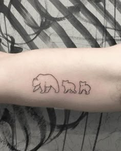 a bear and cub tattoo on the arm