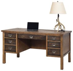 a wooden desk with drawers and a lamp on top