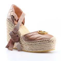 The Gucci Gg Matelasse Leather Platform Espadrilles In Rose Tan Is Crafted In Italy From Raffia And Smooth Leather. These Wedge Heels Feature A Zig Zag, Matelasse Pattern, Espadrille Sole With A Wedge Heel And Platform, Gg Logo At The Front And Tie Ankle Strap. Rose Tan Gg Matelasse Leather Platform Espadrilles Beige Heel 100% Leather Raffia Sole And Heel Wedge Heel Shoes Gg Logo Tie Ankle Strap Almond Shaped Toe Size 39.5 2.5" Platform 4.5" Heel Product Number 573023 Made In Spain Gucci Leather Espadrilles For Beach, Gucci Leather Beach Espadrilles, Brown Gucci Heels For Summer, Gucci Brown Summer Heels, Luxury Beach Espadrilles, Chic Beige High Heel Espadrilles, Luxury Spring Flat Espadrilles, Luxury Round Toe Espadrilles For Beach, Gucci Sandals With Woven Sole For Summer