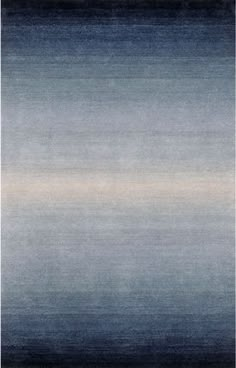 an area rug with blue and grey tones