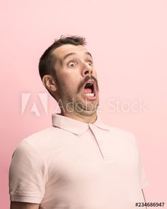 a man with an open mouth on a pink background