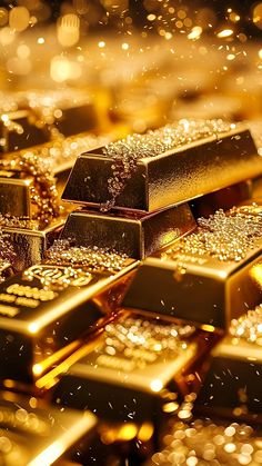 gold bars are stacked on top of each other in this artistic photo with boke