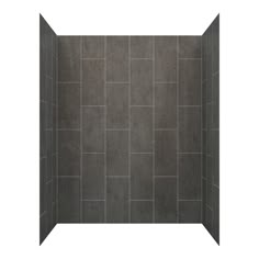 a walk in shower sitting next to a white wall and tiled floor with gray tiles