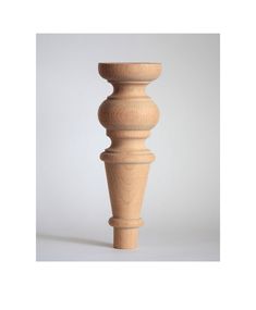 an unfinished wooden candle holder on a white background