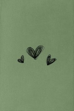 three hearts drawn in black on a green background