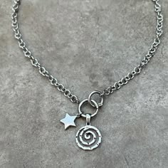 fully stainless steel spiral charm necklace with star & oversized O ring clasp in front 🌀 * tarnish free & waterproof ♾️ * has beautiful circular chain * you can add or remove charms as you please to the O ring clasp ( which is a pretty cool design )  16 inches  * length can be personalized, please message me after purchasing  Comes in PU leather or suede pouch 🎀 Grunge Necklace, Funky Jewellery, Spiral Necklace, Star Necklace Silver, Dream List, Layered Necklaces Silver, Handmade Silver Jewelry, Bear Necklace, Classy Jewelry