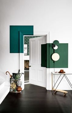 an open door in a room with green and white walls