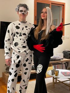 a man and woman dressed up as dalmatian and ladybug for halloween