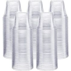 set of six clear glass vases with wavy lines on the bottom and sides, all in